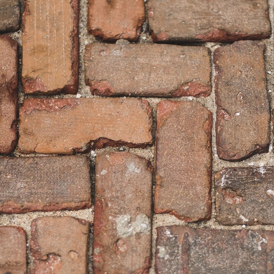 What types of stains and contaminants can soft washing remove from my house walls?