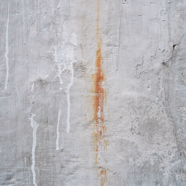 Can pressure washing remove all types of stains from my driveway?