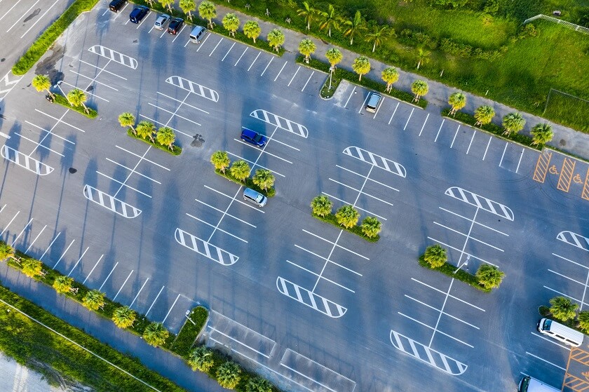 top-down-of-car-park-at-outdoor Reasons to Have Your Parking Lot Professionally Cleaned