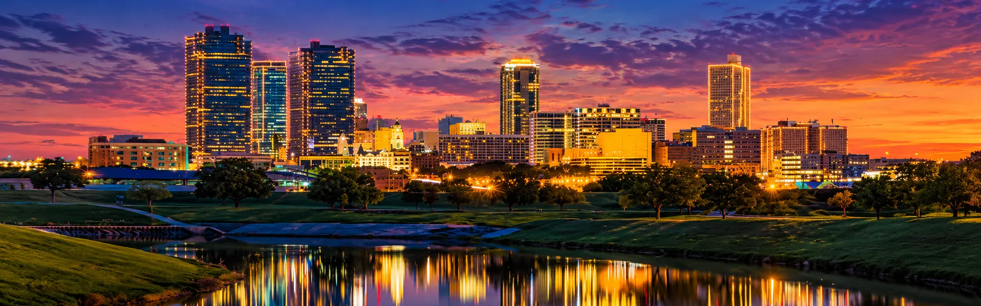 Fort Worth, TX skyline at dusk reflected in the Trinity River